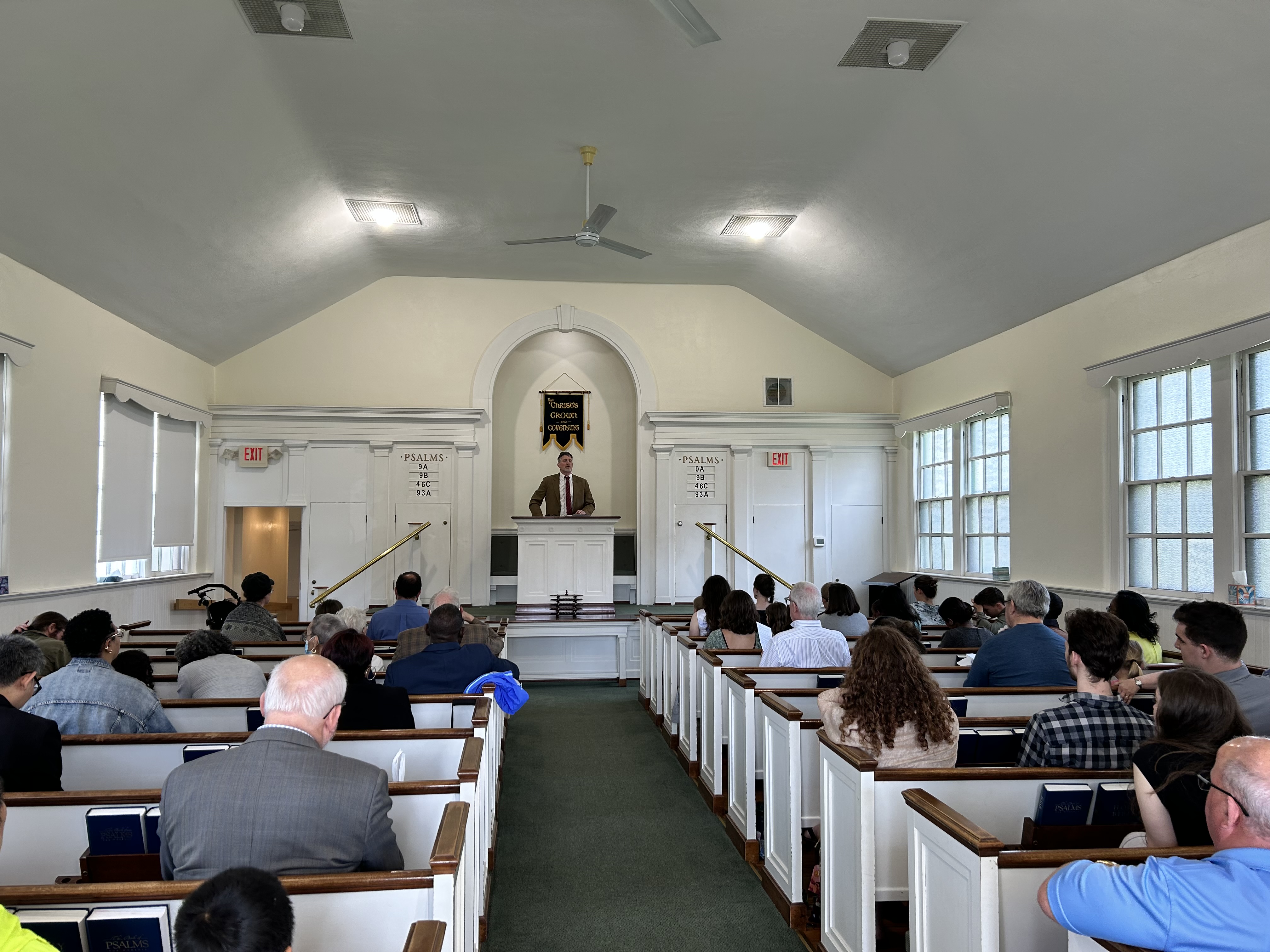 Worshippers gathered in the sanctuary as the pastor preaches